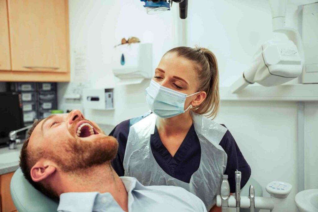 Dentist performing a general dentistry check-up at Total Dental Arts in Centreville, VA