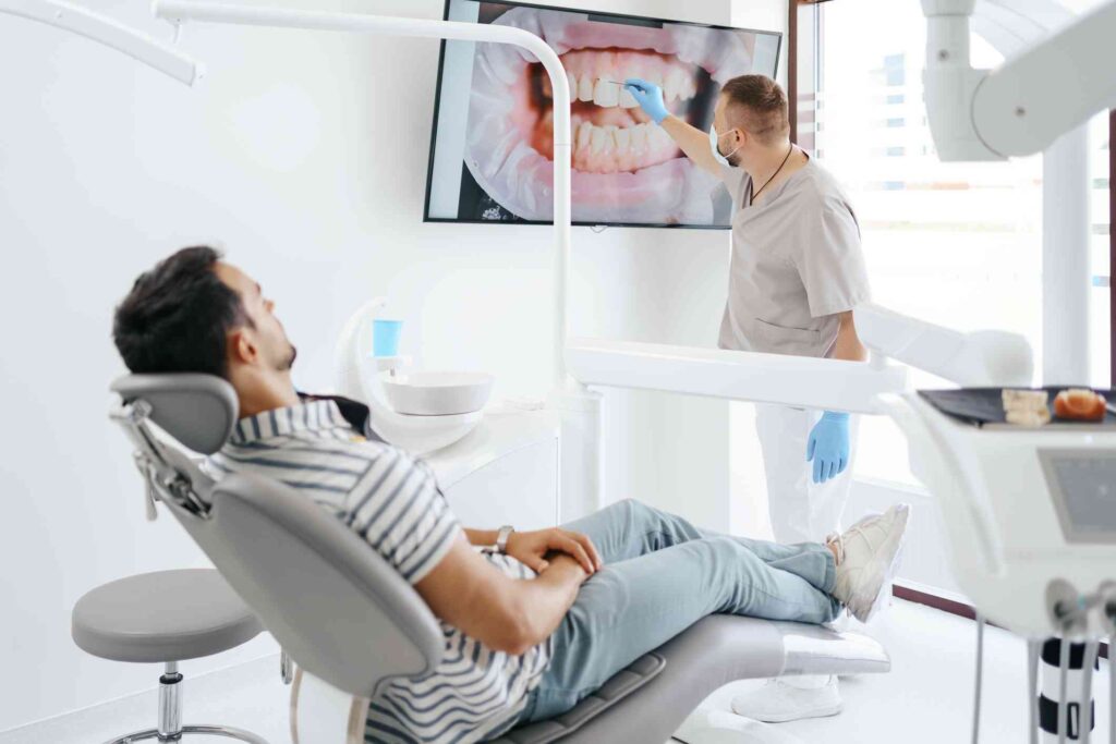 Dentist explaining a dental care treatment to a patient in Centreville, VA