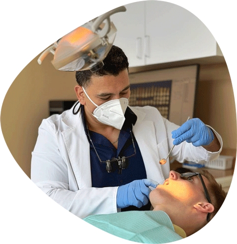 Dr. Kourosh Performing Dental Treatment On A Patient In Centreville, VA