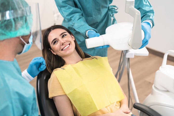 Patient smiling while dentist preparing for dental procedure in Centreville, VA